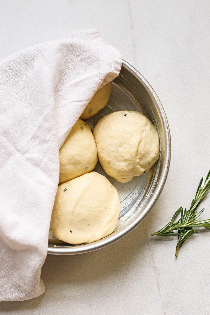 potato dinner rolls in a pan before baking