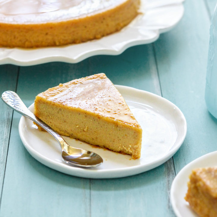 a slice of pumpkin infused creme caramel on a white plate