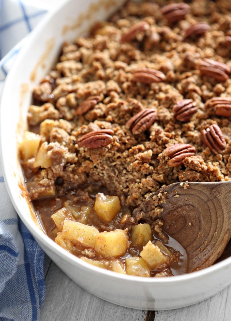 apple crisp in a white baking dish