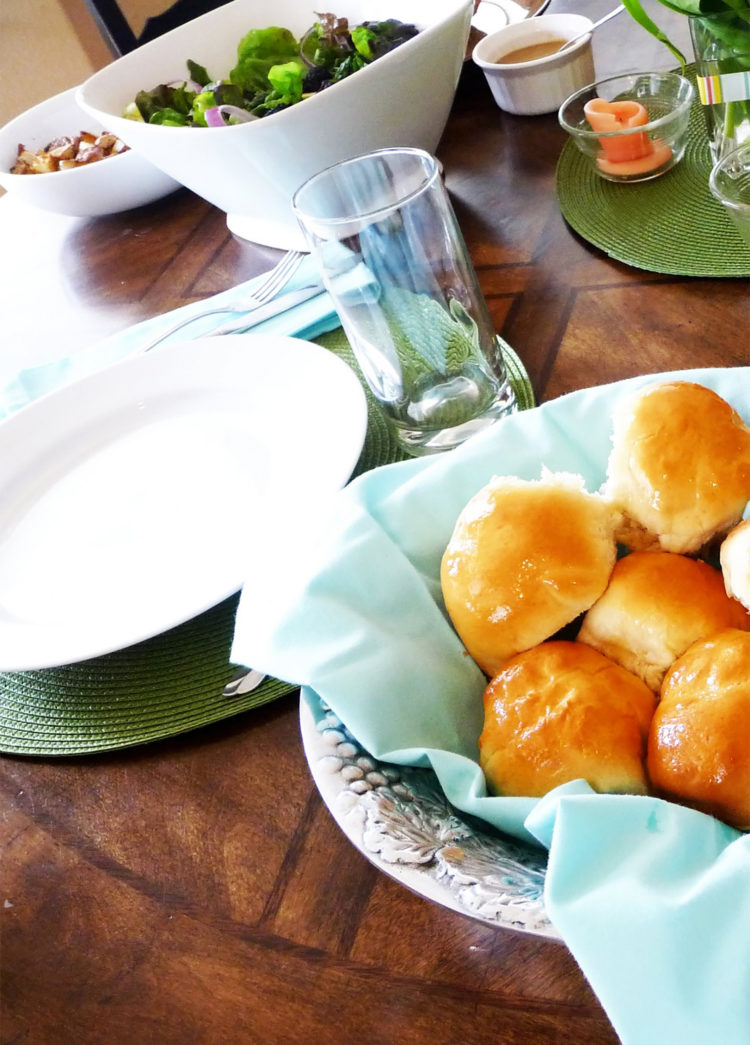 buttery dinner rolls in a bowl on a table