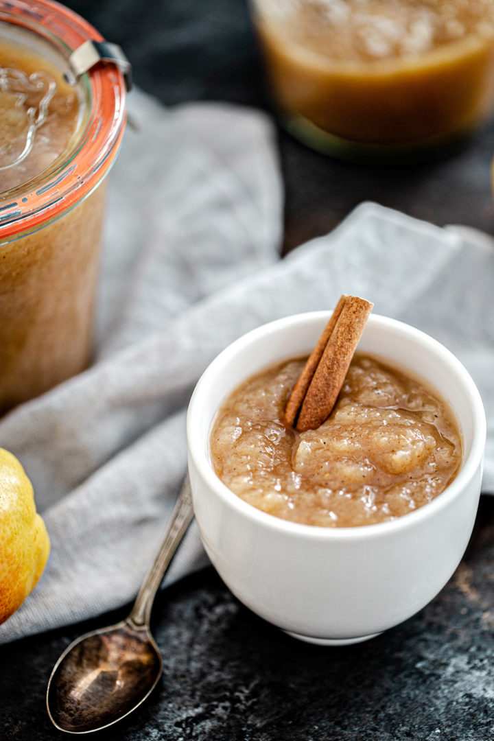 bowl of pear sauce with cinnamon stick