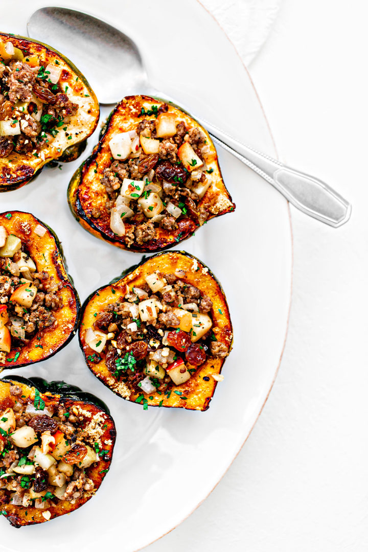 apple stuffed acorn squash on white plate