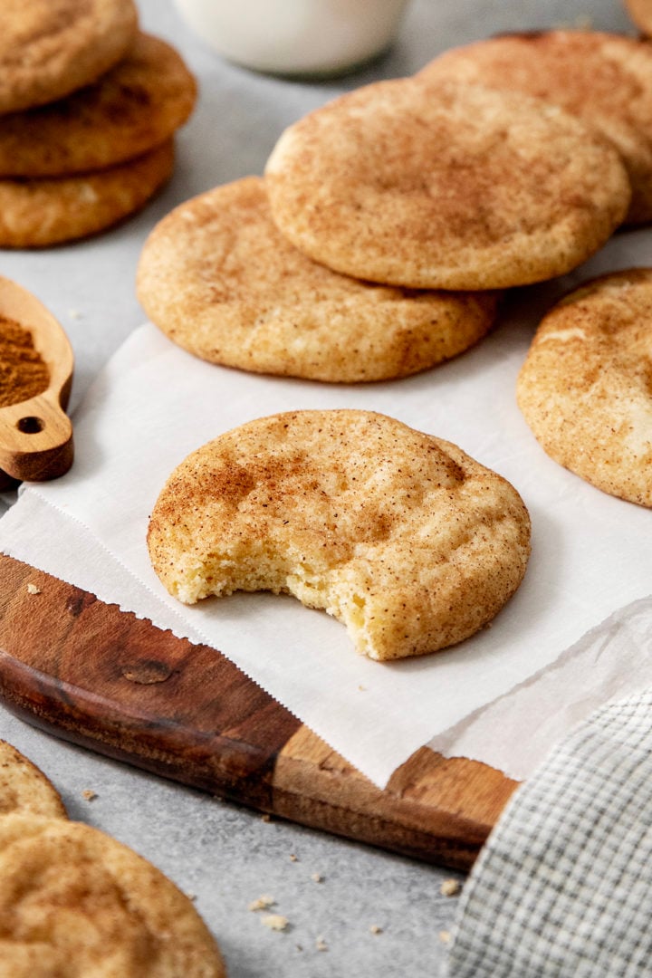 close up photo of an eaten brown butter snickerdoodle cookie