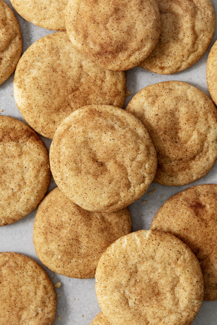 close up overhead photo of a stack of brown butter snickerdoodle cookies