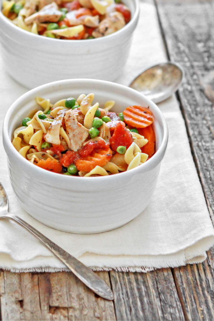 white bowls filled with slow cooker chicken and noodles