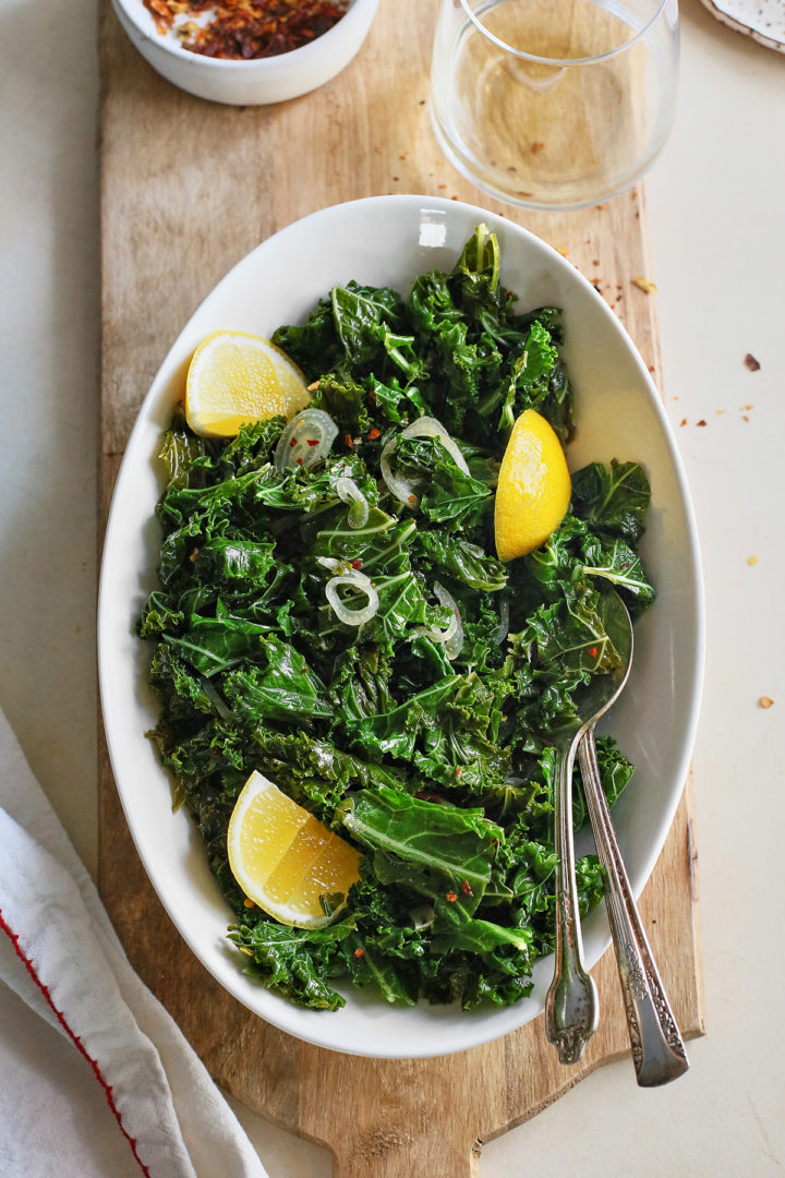 sauteed kale in a white serving dish