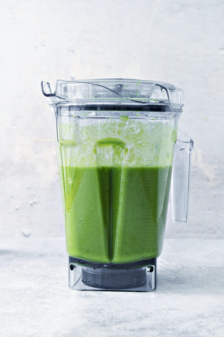 green smoothie blended in a blender