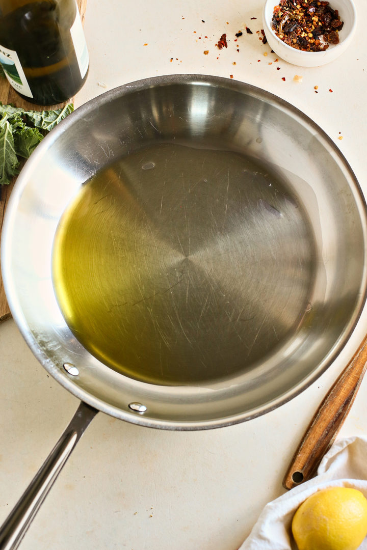 heating olive oil for simple kale recipe 
