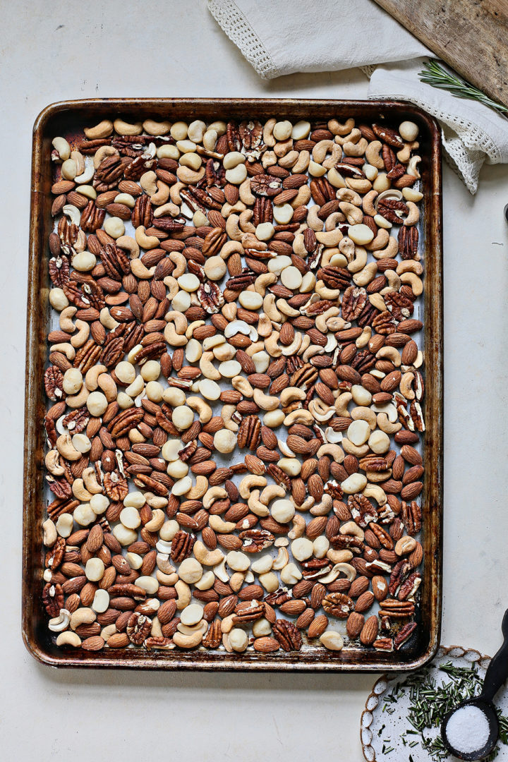 mixed nuts on a baking sheet for a roasted nuts recipe