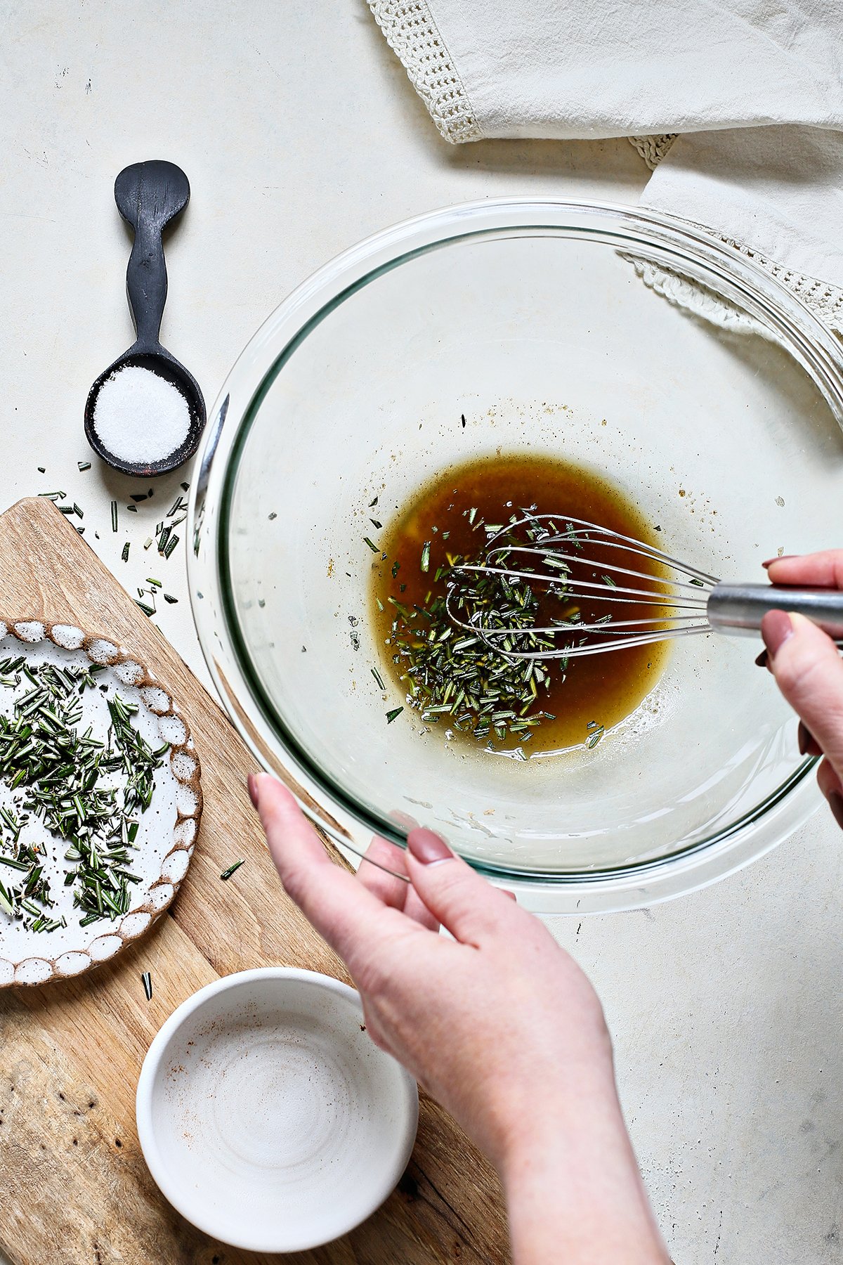 woman making rosemary bar nuts