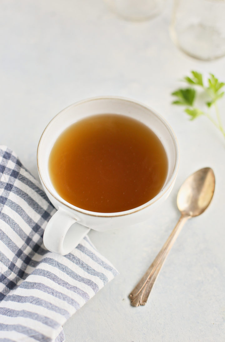 chicken stock served in a white mug