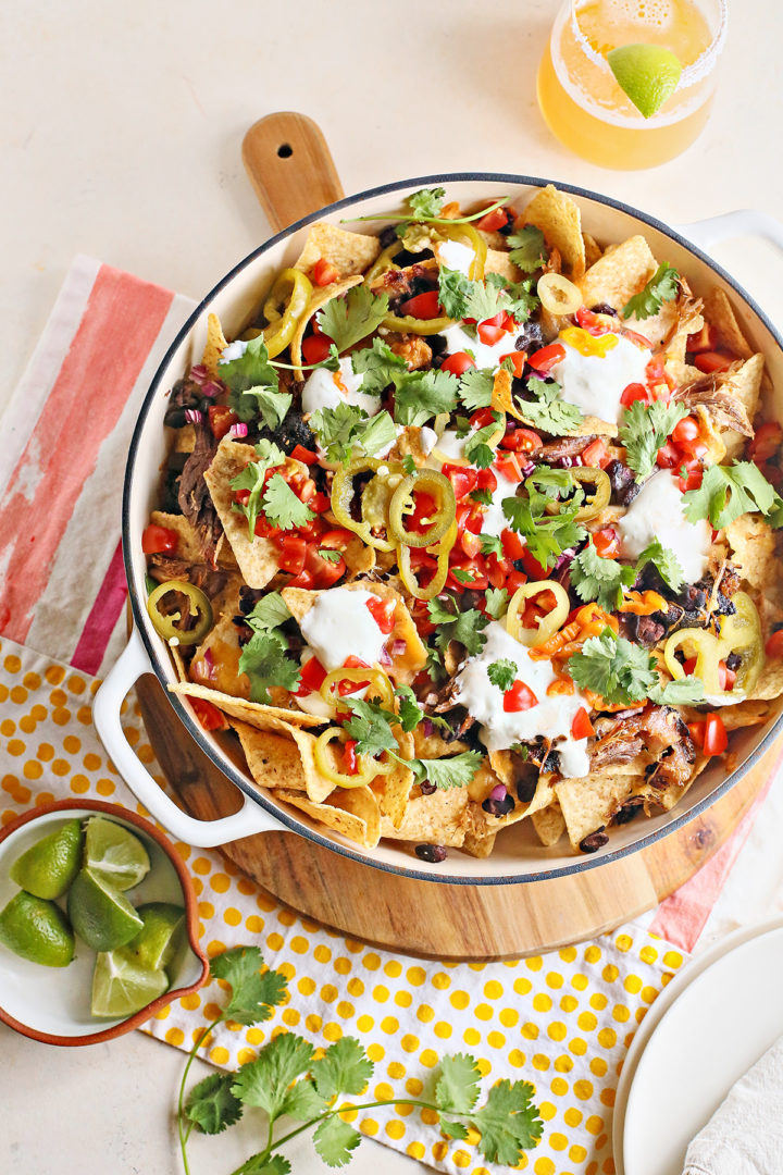 pulled pork nachos in a cast iron pan