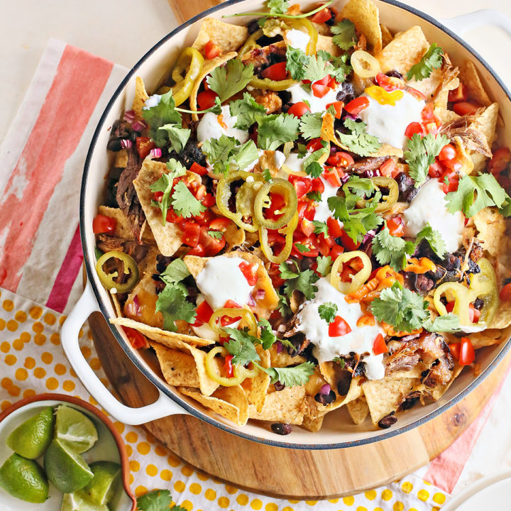 pulled pork nachos in a cast iron pan