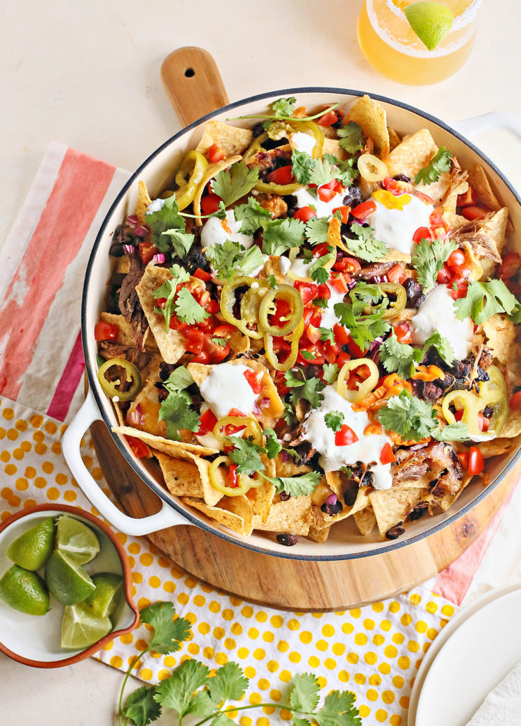 pulled pork nachos in a cast iron pan