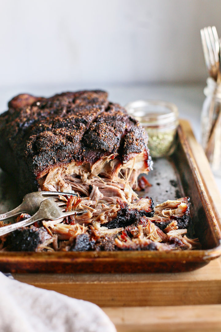 shredded smoked pork shoulder on a baking sheet