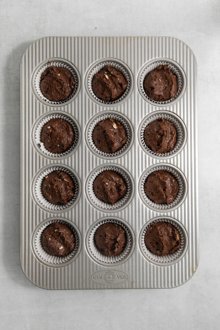 cupcake batter in a cupcake pan for chocolate mint cupcake recipe