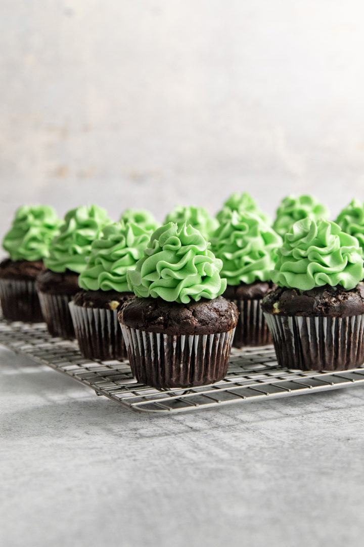 mint chocolate cupcakes on a wire baking rack