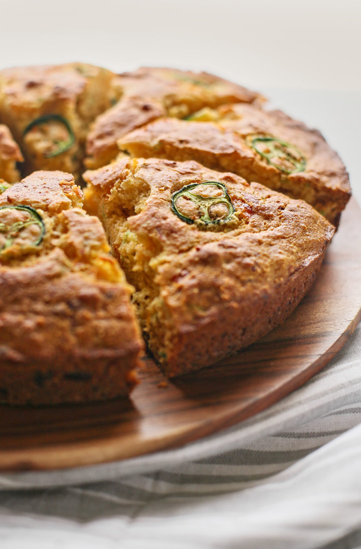 close up of sliced jalapeno cornbread on a cutting board