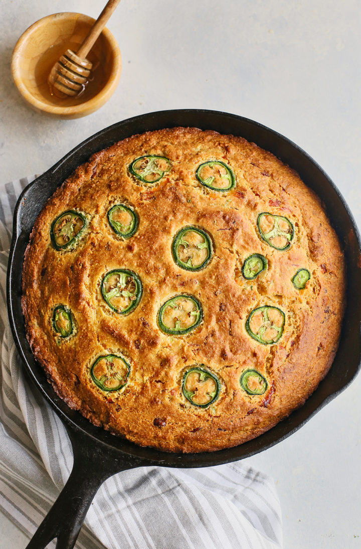 cast iron skillet with baked best cornbead recipe with jalapeños
