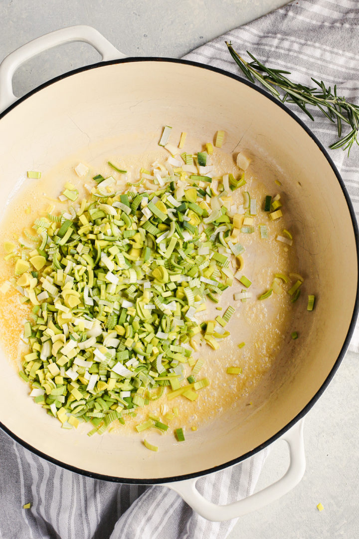 cooking leeks for creamy mushroom risotto