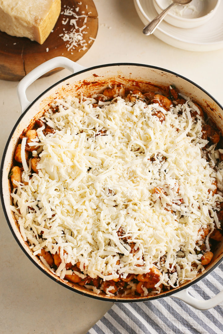 gnocchi bake recipe topped with grated cheese ready to go in the oven