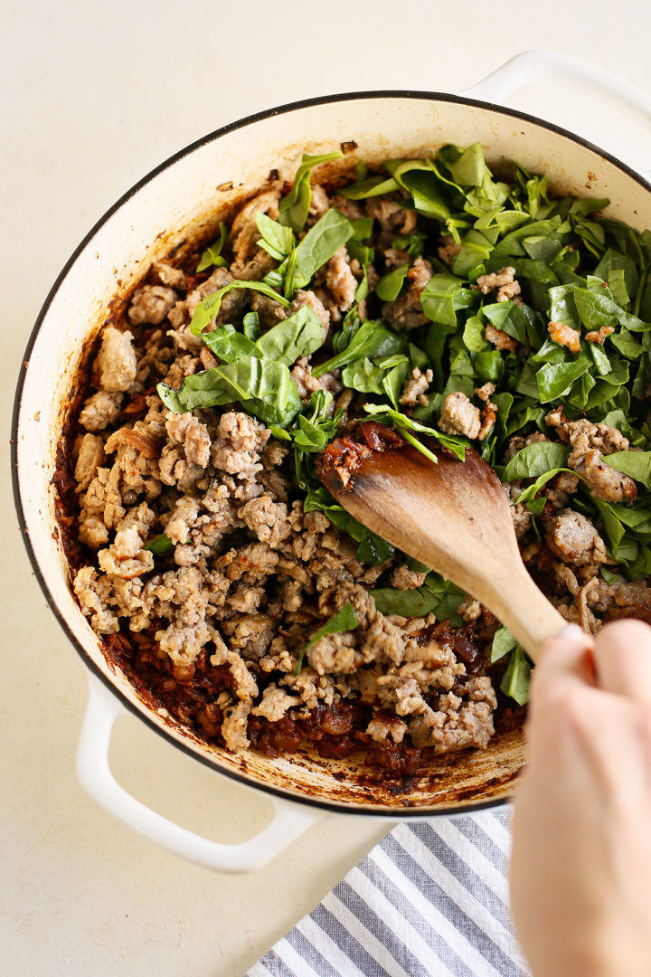 woman making gnocchi casserole
