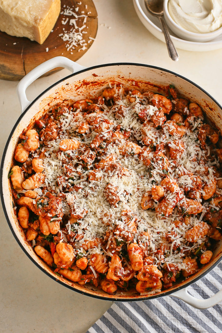 gnocchi casserole in a baking pan topped with parmesan cheese