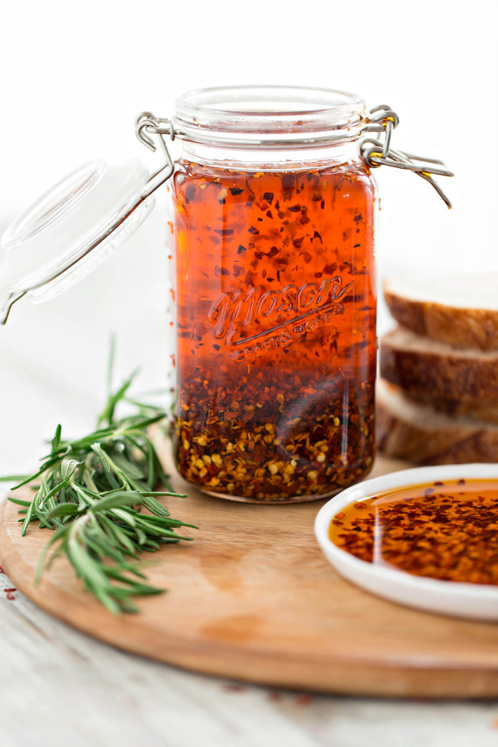 photo of homemade garlic chili oil on a wooden cutting board