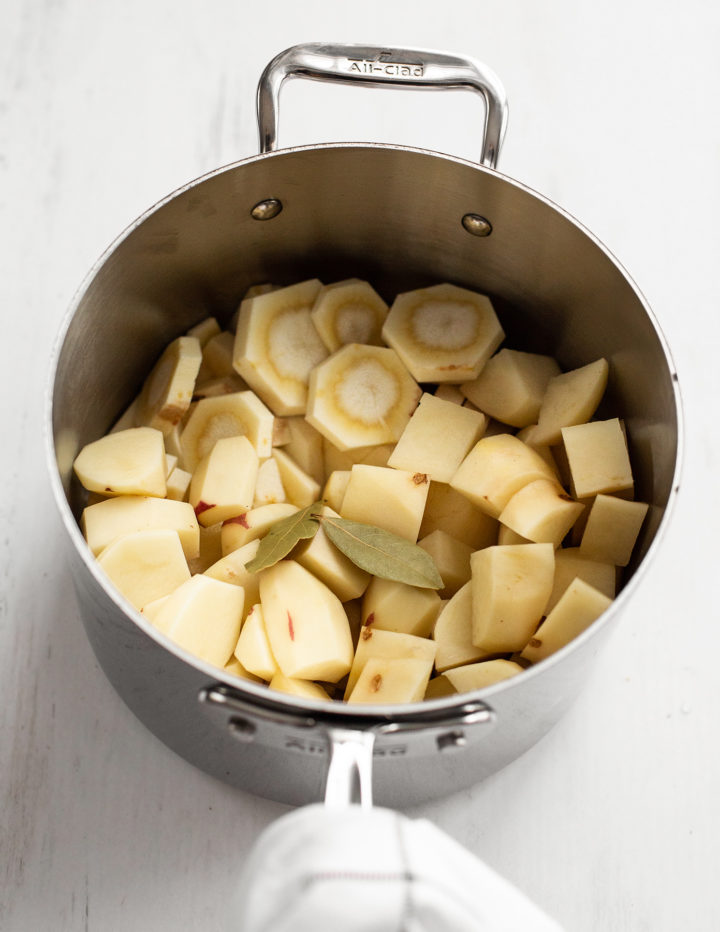 ingredients to make colcannon potatoes in a stainless steel pot