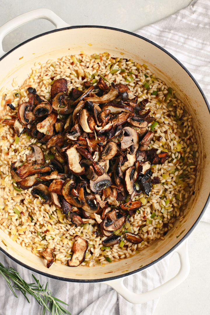 adding wild mushrooms to risotto