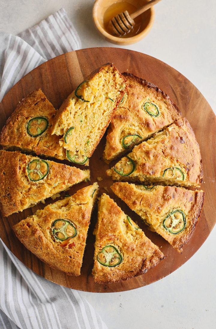 overhead photo of slices of jalapeno cornbread on a cutting board