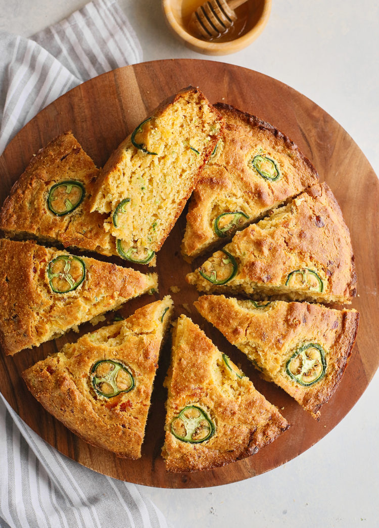 overhead photo of sliced cornbread with jalapenos