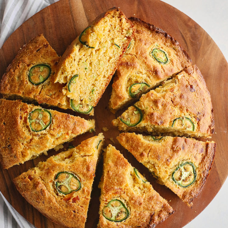 overhead photo of sliced cornbread with jalapenos