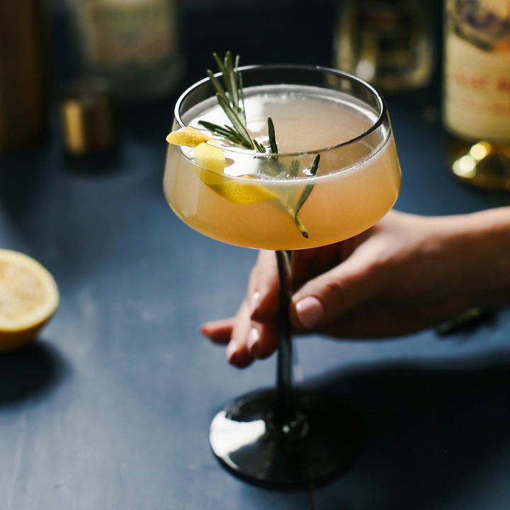 woman holding a glass of french blonde cocktail