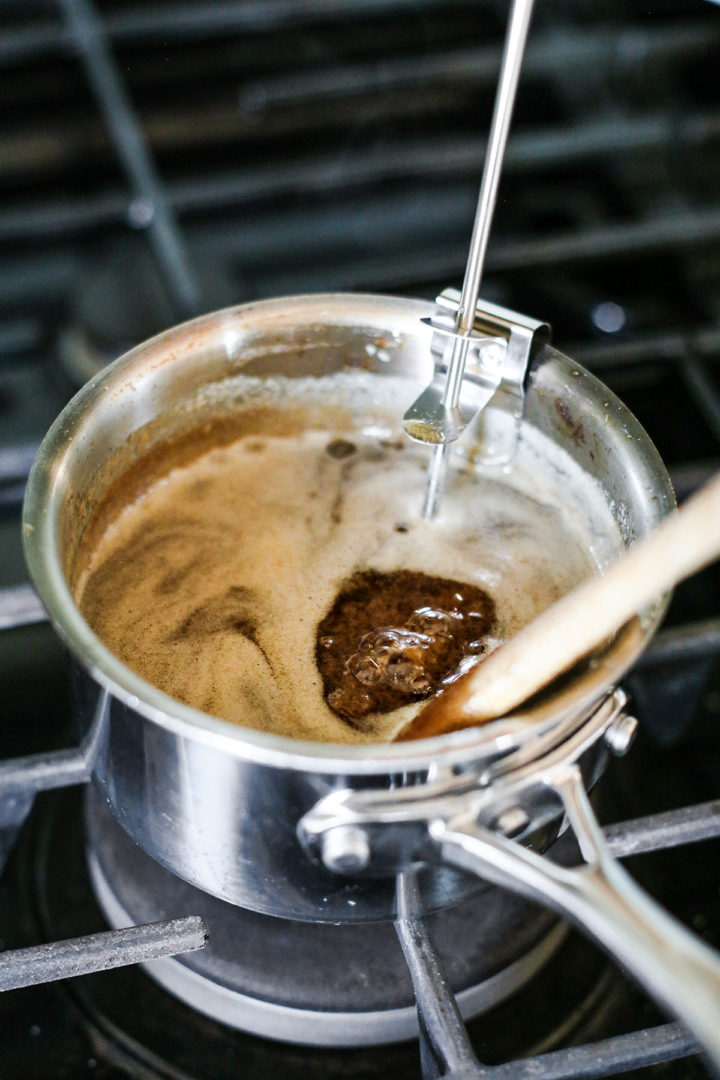 caramel frosting cooking on the stove for guinness brownies