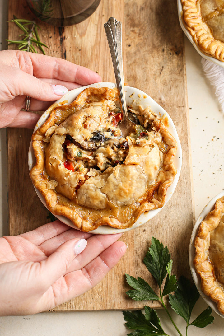 woman holding a mini chicken pot pie