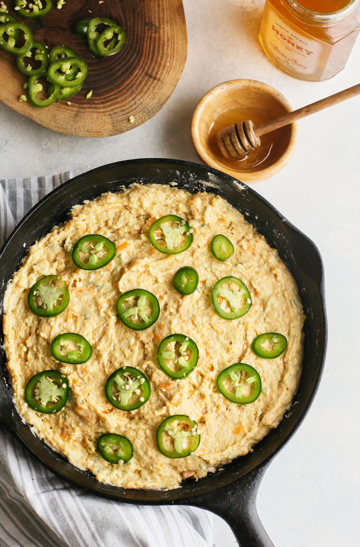 batter for sweet cornbread with jalapenos in a cast iron skillet
