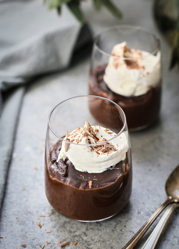 homemade chocolate pudding in glasses with whipped cream garnish
