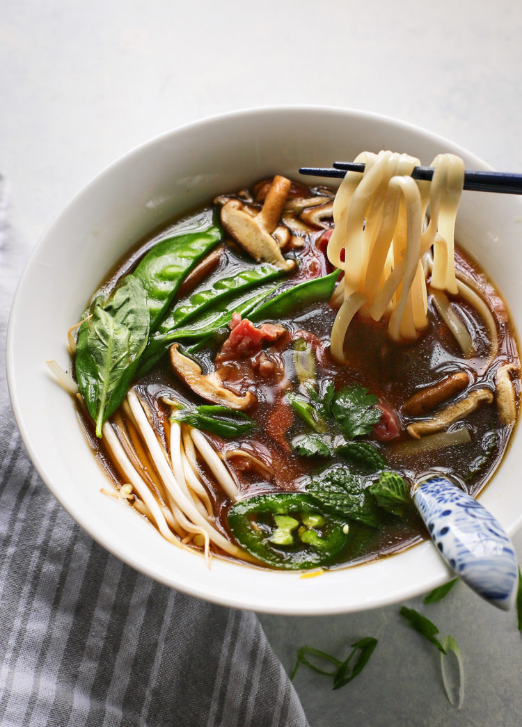 Vietnamese beef noodle soup in a white bowl