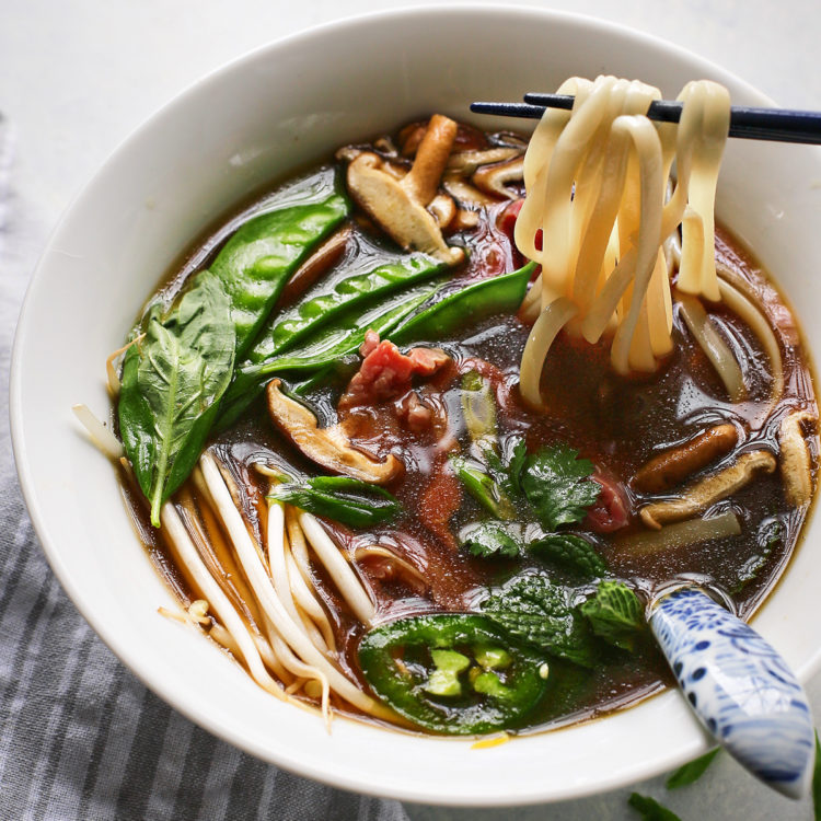 Vietnamese beef noodle soup in a white bowl
