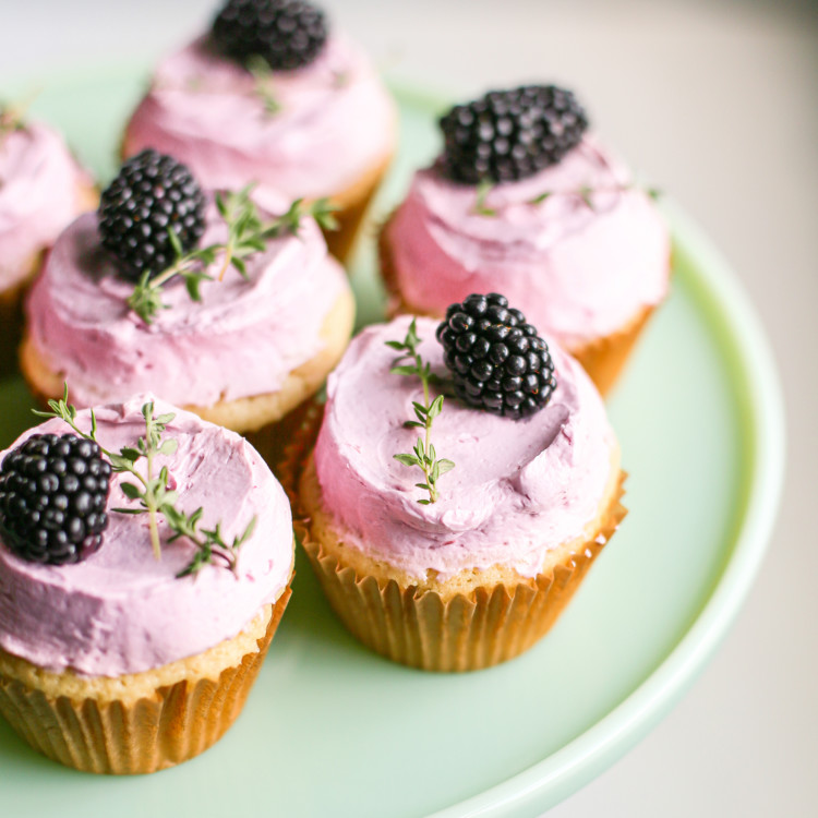 blackberry lemon cupcakes on a cake stand