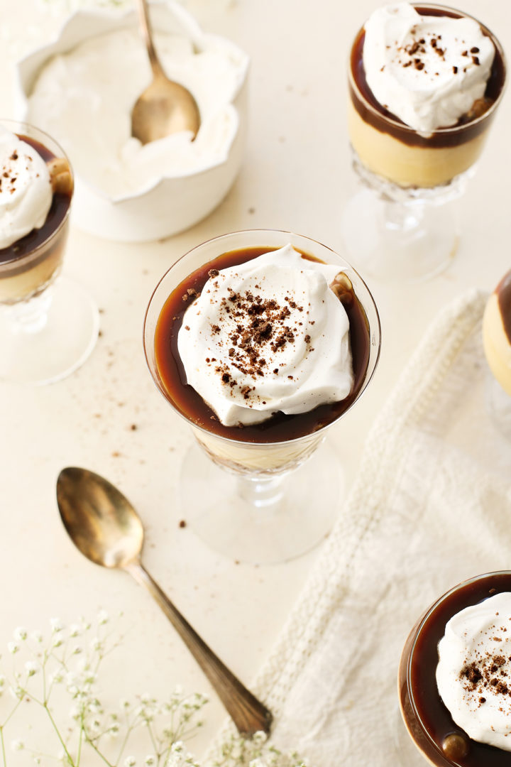 salted caramel budino in dessert glasses on a cream background