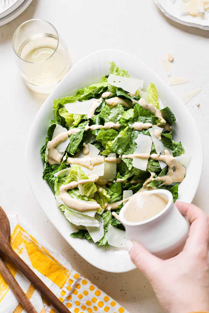 the best caesar salad in a white salad bowl