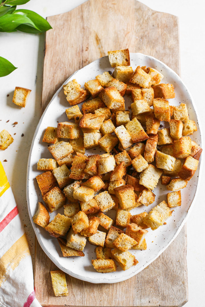 homemade sourdough croutons on a white platter