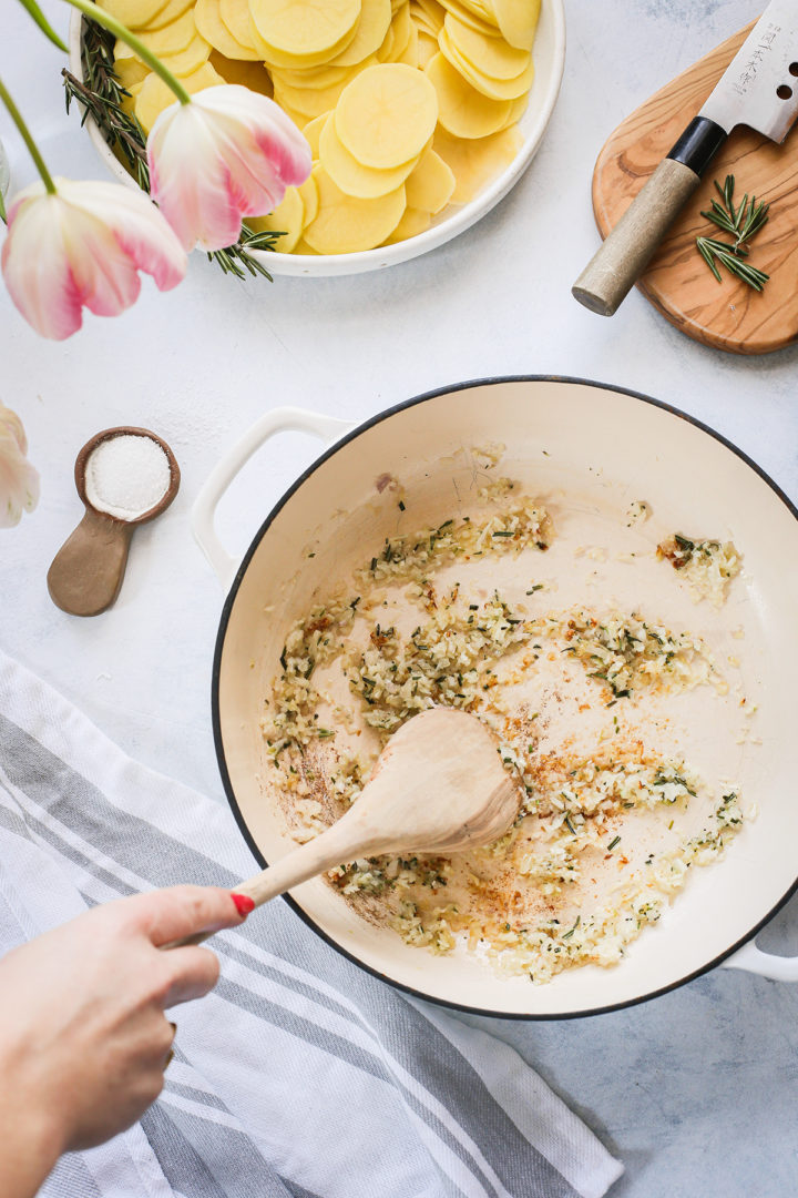 woman cooking scalloped potatoes