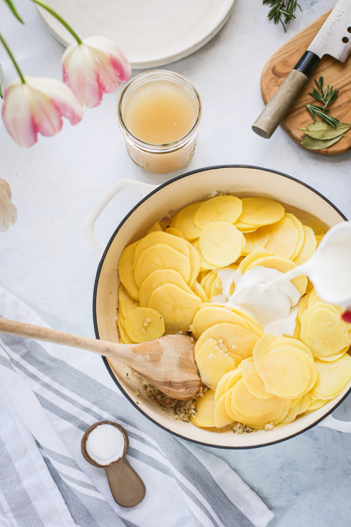 adding cream to scalloped potatoes recipe