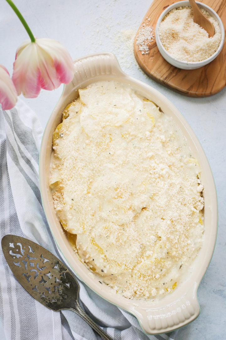 cheesy scalloped potatoes in a casserole dish