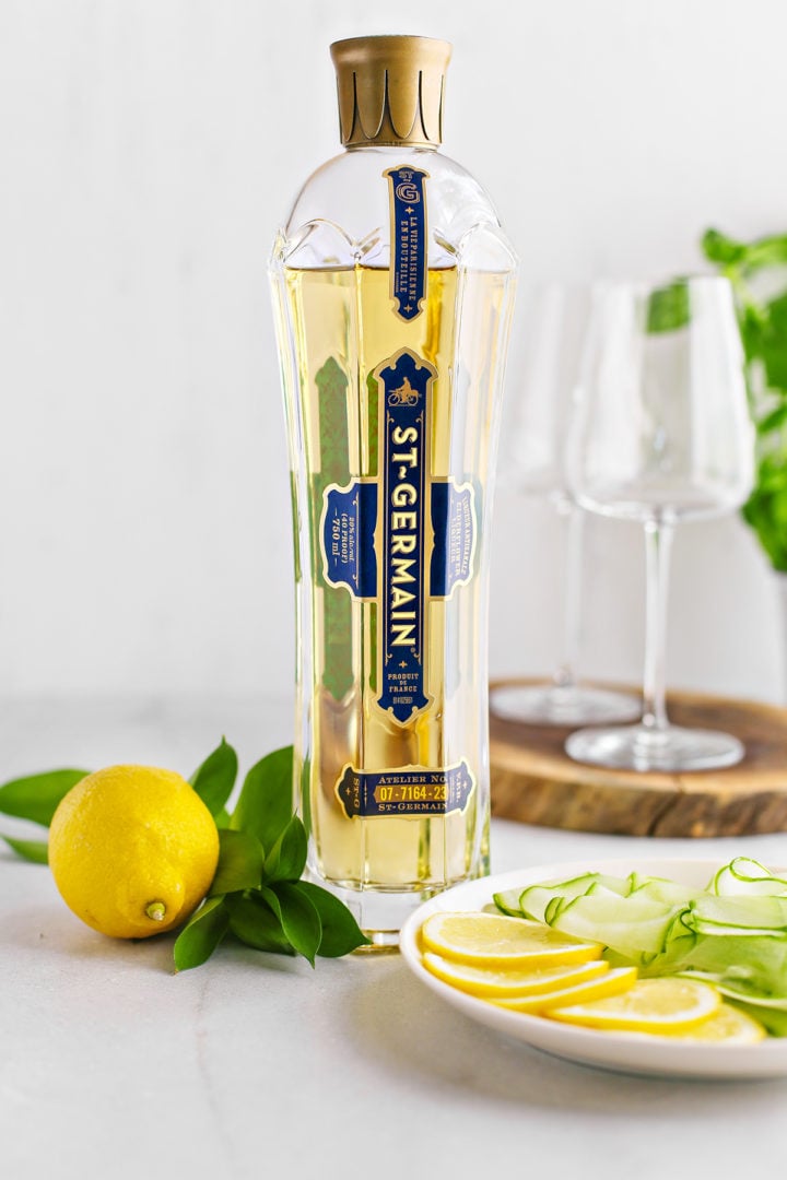 ingredients for a St. Germain prosecco spritz on a marble counter