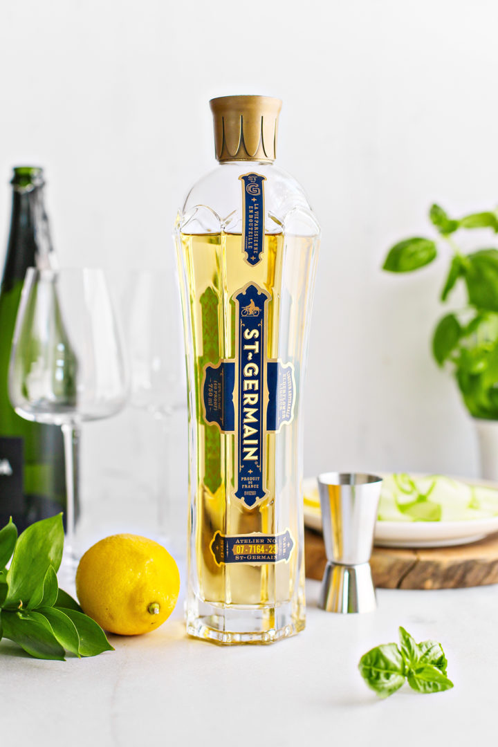 ingredients needed to make a st. germain spritz with fresh lemon, basil, and cucumber