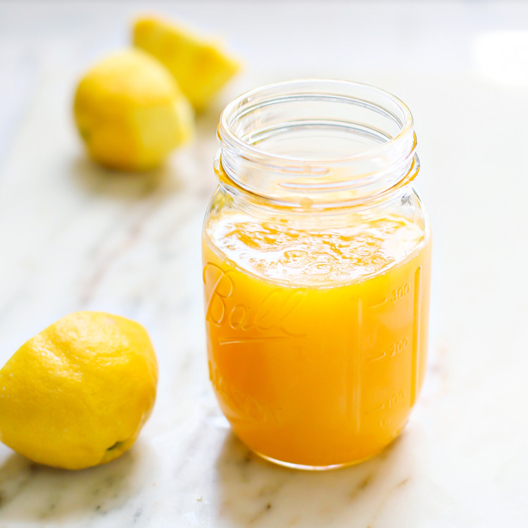 homemade lemon curd in a ball canning jar on top of a marble counter top